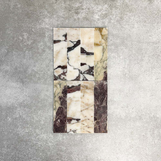 Fayrouz Viola 5 × 20 cm Naturmarmorfliesen mit geschliffener Oberfläche, mit weißer Basis und markanter bordeauxroter sowie warmtoniger Maserung, im sauberen Raster verlegt, um natürliche Variation und die charakteristische Steinstruktur hervorzuheben.